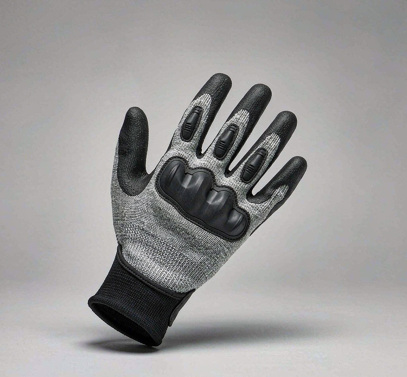 Cut-resistant HPPE glove with nitrile coating and TPR impact shield