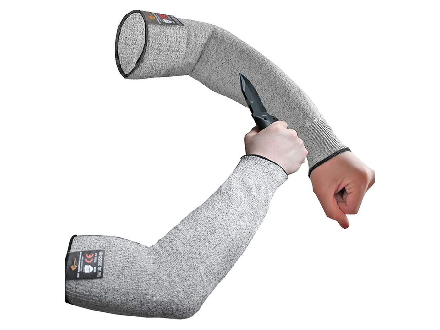 Cut-resistant arm sleeve in use, being cut through with scissors to demonstrate the knitted HPPE structure